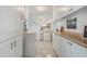 Bright laundry room with white cabinetry, countertop space, and modern washer and dryer at 3943 Chambers St, Lake Wales, FL 33898