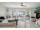 Bright living room with serene lake views through sliding glass doors leading to an outdoor patio space at 3943 Chambers St, Lake Wales, FL 33898