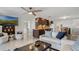 Cozy living area with dark wood accents and a comfortable seating arrangement by the kitchen at 3943 Chambers St, Lake Wales, FL 33898