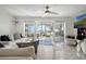 Bright living room with tile floors and sliding doors opening to a scenic outdoor space at 3943 Chambers St, Lake Wales, FL 33898