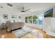 Bright main bedroom with water views, hardwood floors, and a ceiling fan at 3943 Chambers St, Lake Wales, FL 33898