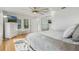 Main bedroom features hardwood floors, closet with mirrors, and views of a TV at 3943 Chambers St, Lake Wales, FL 33898