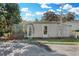 View of the shed from the exterior. Features a quaint backyard shed with a small garden at 3943 Chambers St, Lake Wales, FL 33898