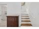 Wooden staircase complements the home's interior, adjacent to built-in storage at 3943 Chambers St, Lake Wales, FL 33898