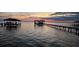 Calm waterfront view featuring docks, gazebos and scenic reflections at sunset at 3943 Chambers St, Lake Wales, FL 33898