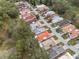 Aerial view of a residential neighborhood with mature trees surrounding homes at 407 San Jose Dr, Winter Haven, FL 33884