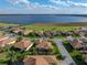 An aerial view of the house in a neighborhood near a lake at 4080 Ashton Club Dr, Lake Wales, FL 33859