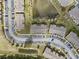 Birds-eye view of townhome community with ponds and ample parking spaces at 4084 Winding Vine Dr, Lakeland, FL 33812