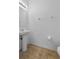 Simple bathroom with a pedestal sink, tile floors, and neutral walls at 4084 Winding Vine Dr, Lakeland, FL 33812