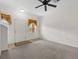 Living room showcasing carpeted floors, white walls, and a well-lit entrance at 4084 Winding Vine Dr, Lakeland, FL 33812