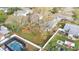 Aerial view of home highlighting the backyard, fence, and mature trees at 433 Carleton St, Lakeland, FL 33803