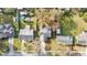 Overhead view of the property highlighting the roof, long driveway, mature landscaping, and proximity to neighboring homes at 433 Carleton St, Lakeland, FL 33803