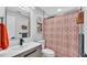 Bathroom with a modern vanity, a shower with a patterned curtain, and neutral tones for a clean aesthetic at 433 Carleton St, Lakeland, FL 33803