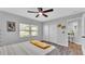 Airy bedroom with a ceiling fan, natural light, closet, and modern decor, creating a relaxing atmosphere at 433 Carleton St, Lakeland, FL 33803