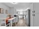 Bright kitchen featuring white cabinets, stainless steel appliances, and a charming dining area at 433 Carleton St, Lakeland, FL 33803