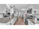 Spacious kitchen offers granite countertops, stainless steel appliances, white cabinets and wood-look flooring at 433 Carleton St, Lakeland, FL 33803