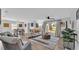 Bright living room with stylish furniture, a ceiling fan, and sliding glass doors to the backyard at 433 Carleton St, Lakeland, FL 33803