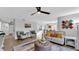 Open-concept living room showcasing modern decor and seamless flow to dining area and kitchen at 433 Carleton St, Lakeland, FL 33803