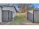 Home's side yard is enclosed by modern wood fencing at 433 Carleton St, Lakeland, FL 33803