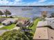 Aerial view of homes surrounding Lake Dexter with access to a community boat ramp, offering waterfront living and recreational opportunities at 4422 Glenns Lndg, Winter Haven, FL 33884