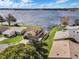 Aerial view of homes surrounding Lake Dexter with access to a community boat ramp, offering waterfront living and recreational opportunities at 4422 Glenns Lndg, Winter Haven, FL 33884