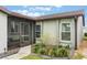 Charming entryway with a screened-in porch and decorative landscaping at 4422 Glenns Lndg, Winter Haven, FL 33884