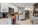 Bright kitchen with white cabinets, modern stainless-steel appliances, and tile backsplash at 4422 Glenns Lndg, Winter Haven, FL 33884