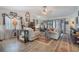 Bright living room with vaulted ceilings, wood floors, and slider to outside patio at 4422 Glenns Lndg, Winter Haven, FL 33884