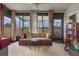 Relaxing screened patio featuring outdoor seating, neutral decor, and a ceiling fan at 4422 Glenns Lndg, Winter Haven, FL 33884