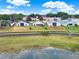 Aerial view of the backyard, neighboring houses and beautiful lake perfect for enjoying outdoor living at 496 Lake Suzanne Dr, Lake Wales, FL 33859