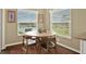 Cozy breakfast nook with views of the water from a large picture window at 496 Lake Suzanne Dr, Lake Wales, FL 33859