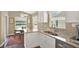 Sunlit breakfast nook with stainless appliances, granite countertops, and views of the water at 496 Lake Suzanne Dr, Lake Wales, FL 33859