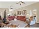 Inviting living room with an open layout, ceiling fans, ample seating, and stylish furnishings for relaxation and entertainment at 496 Lake Suzanne Dr, Lake Wales, FL 33859