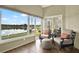 Relaxing sunroom with scenic lake views and comfortable seating at 496 Lake Suzanne Dr, Lake Wales, FL 33859