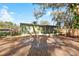 Cozy home with a large yard, screened in porch and charming wood fence for privacy at 519 Sharon Hill Ct, Winter Haven, FL 33880