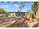 Charming home featuring a large screened porch, wood fence, and mature landscaping at 519 Sharon Hill Ct, Winter Haven, FL 33880