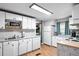 Bright kitchen with white appliances, a practical layout and plenty of counter space at 519 Sharon Hill Ct, Winter Haven, FL 33880