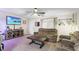 Living room features plush seating, entertainment area, and windows for natural light at 519 Sharon Hill Ct, Winter Haven, FL 33880