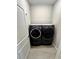 Modern laundry room featuring a washer and dryer set at 5467 Maddie Dr, Haines City, FL 33844