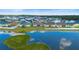 A neighborhood aerial view by the lake with well-maintained homes in a lakeside community at 5767 Lakeside Landings Blvd, Winter Haven, FL 33881