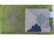 A detailed aerial view shows the roof's solar panels and well maintained lawn at 5767 Lakeside Landings Blvd, Winter Haven, FL 33881