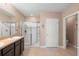 This bathroom includes a double sink vanity and a walk-in shower at 5767 Lakeside Landings Blvd, Winter Haven, FL 33881