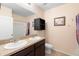 Bright bathroom with double sinks, modern vanity, and a large mirror at 5767 Lakeside Landings Blvd, Winter Haven, FL 33881