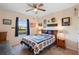 Charming bedroom with patriotic-themed decor, a comfortable bed, and natural light at 5767 Lakeside Landings Blvd, Winter Haven, FL 33881