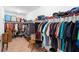 Large walk-in closet with an abundance of hanging storage and shelving at 5767 Lakeside Landings Blvd, Winter Haven, FL 33881