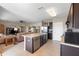 Spacious kitchen featuring an island that opens up to the living room at 5767 Lakeside Landings Blvd, Winter Haven, FL 33881