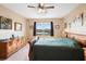 Comfortable main bedroom offering natural light, plush carpeting, and peaceful atmosphere at 5767 Lakeside Landings Blvd, Winter Haven, FL 33881