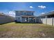 Spacious backyard featuring a covered patio and full fence, perfect for outdoor activities at 578 Preserve Pointe Blvd, Davenport, FL 33837