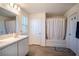 Bathroom featuring dual sinks, bathtub with shower, tile floor and window for natural light at 578 Preserve Pointe Blvd, Davenport, FL 33837