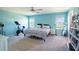 Well-lit bedroom with exercise bike and space for a home office at 578 Preserve Pointe Blvd, Davenport, FL 33837